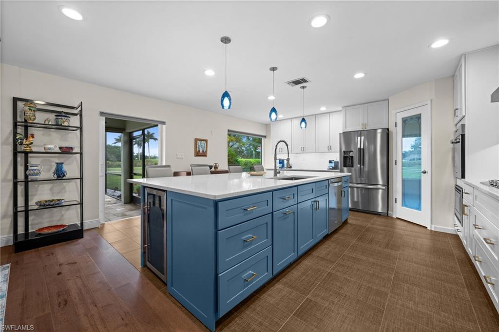 1960 Imperial Golf Course Boulevard Naples, FL 34110 - Photo 10 of 38 Open-concept kitchen showcasing craftsmanship, function, and timeless design