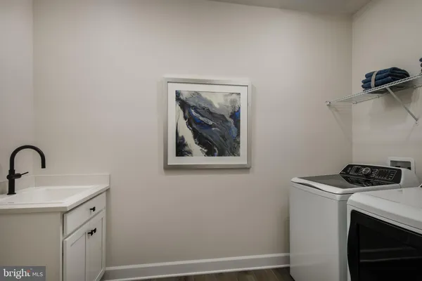 a room with a sink and cabinets