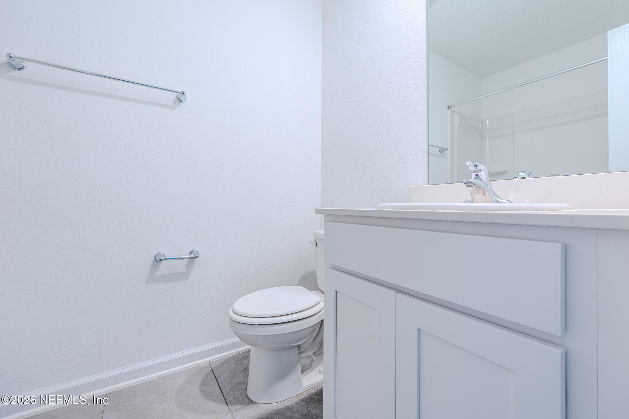244 Elmhurst Lane St. Augustine, FL 32084 - Photo 12 of 19 a bathroom with a sink a toilet and a mirror