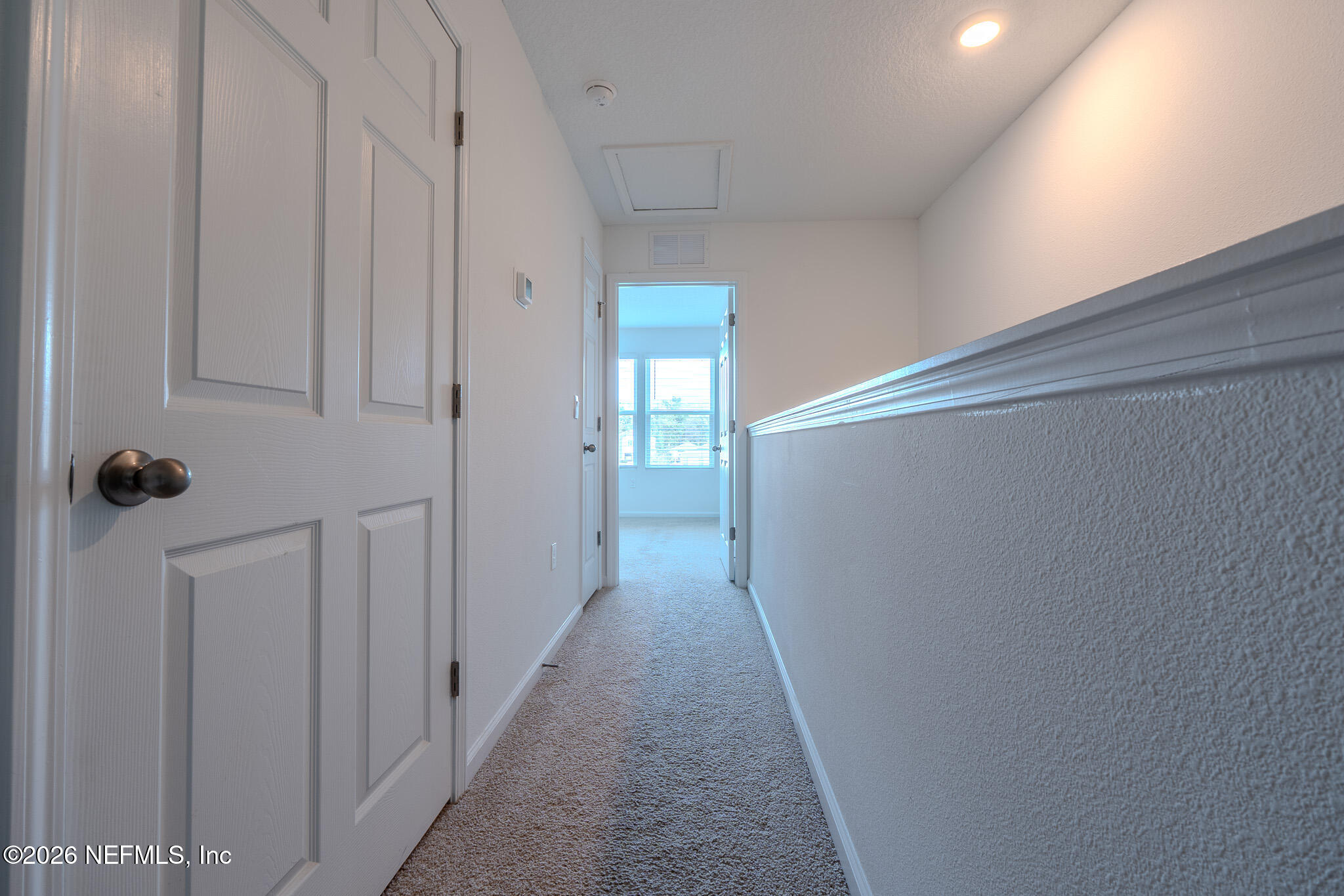 244 Elmhurst Lane St. Augustine, FL 32084 - Photo 14 of 19 a view of a hallway with wooden floor