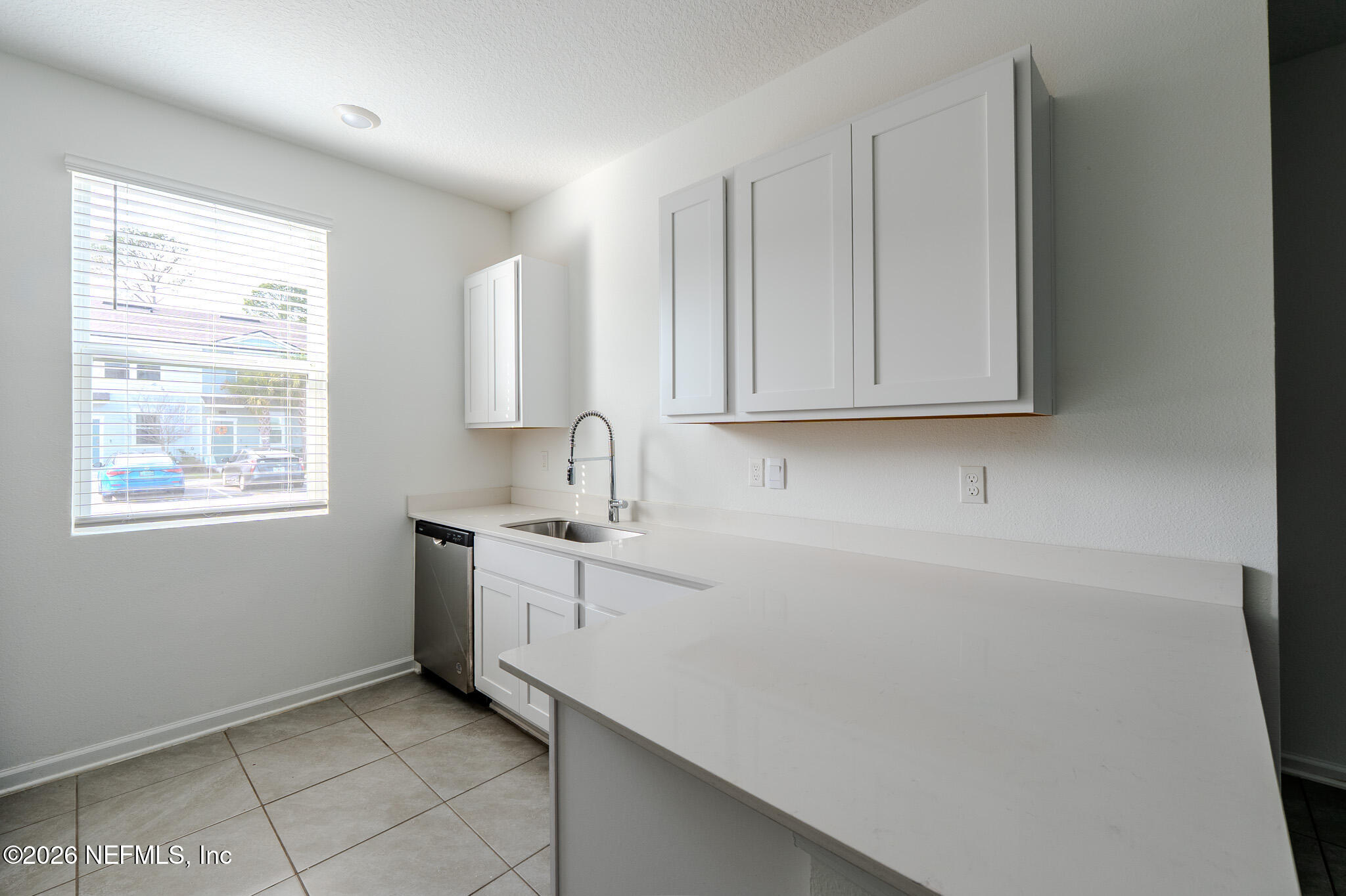 244 Elmhurst Lane St. Augustine, FL 32084 - Photo 6 of 19 a room with a sink cabinets and a window