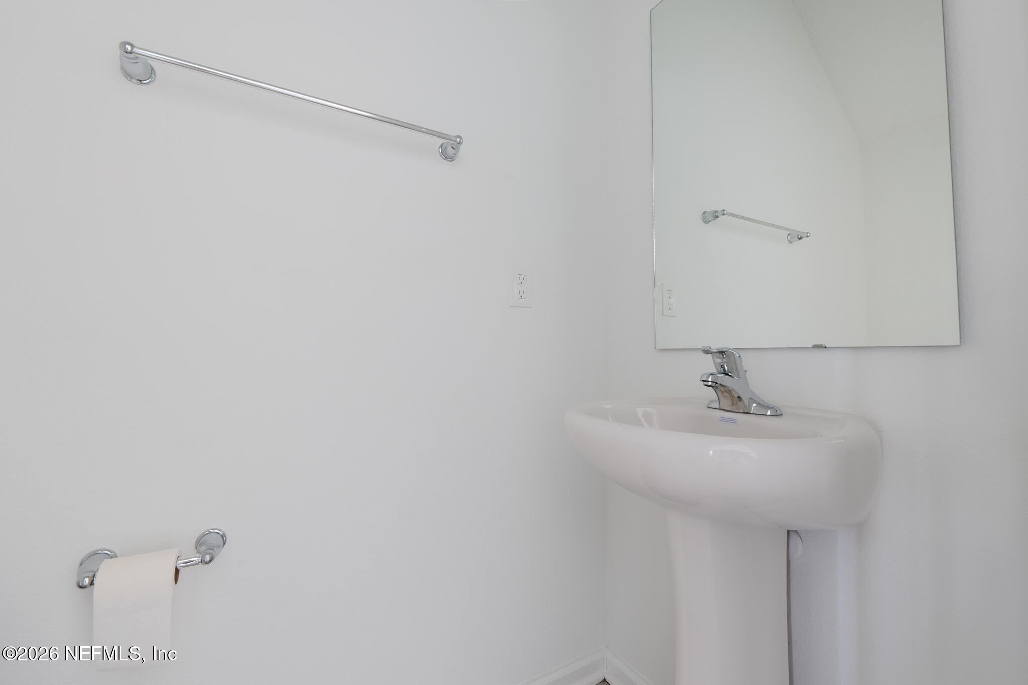 244 Elmhurst Lane St. Augustine, FL 32084 - Photo 9 of 19 a bathroom with a sink and mirror