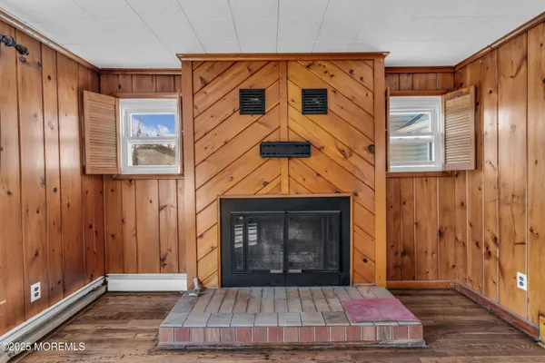 a living room with a fireplace furniture and a window