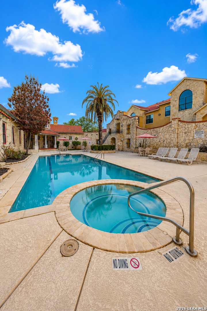 6160 Eckhert Road, Unit 804 San Antonio, TX 78240 - Photo 35 of 38 a view of a swimming pool with a lounge chairs