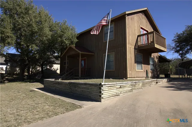 a view of a house with a street