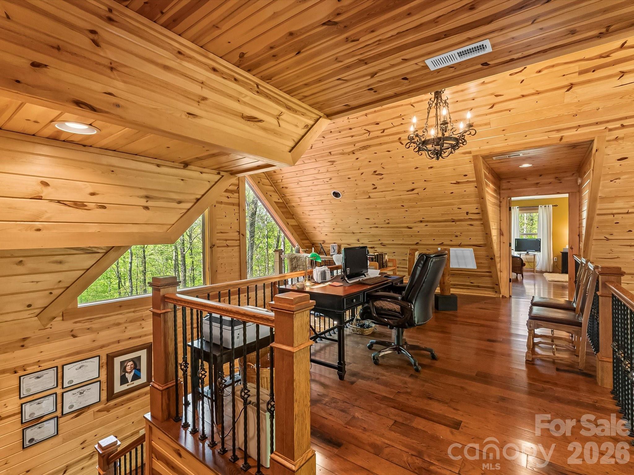917 Otter Mountain Road Topton, NC 28781 - Photo 32 of 48 a view of a patio with table and chairs with wooden floor and fence