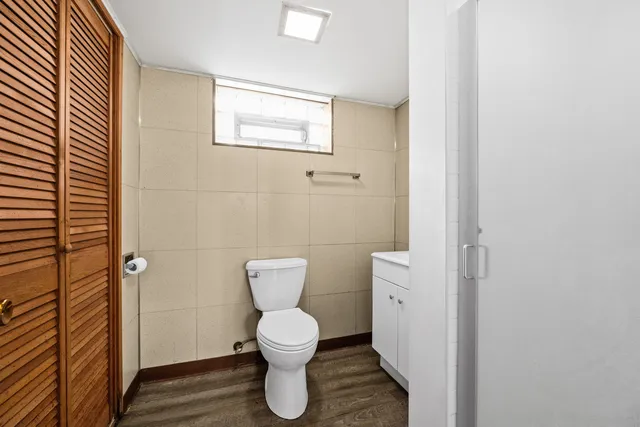 a bathroom with a toilet and a sink