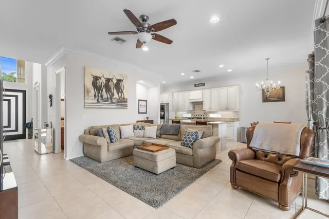 a kitchen with granite countertop a sink cabinets and window