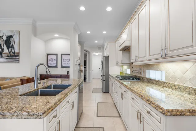 a bathroom with a tub sink shower and mirror