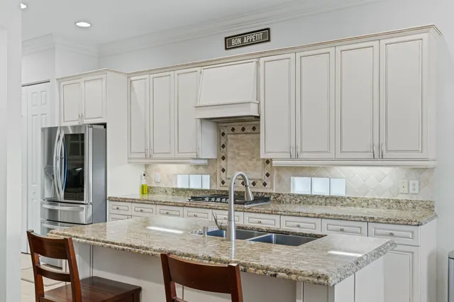 a spacious bathroom with a tub sink and mirror