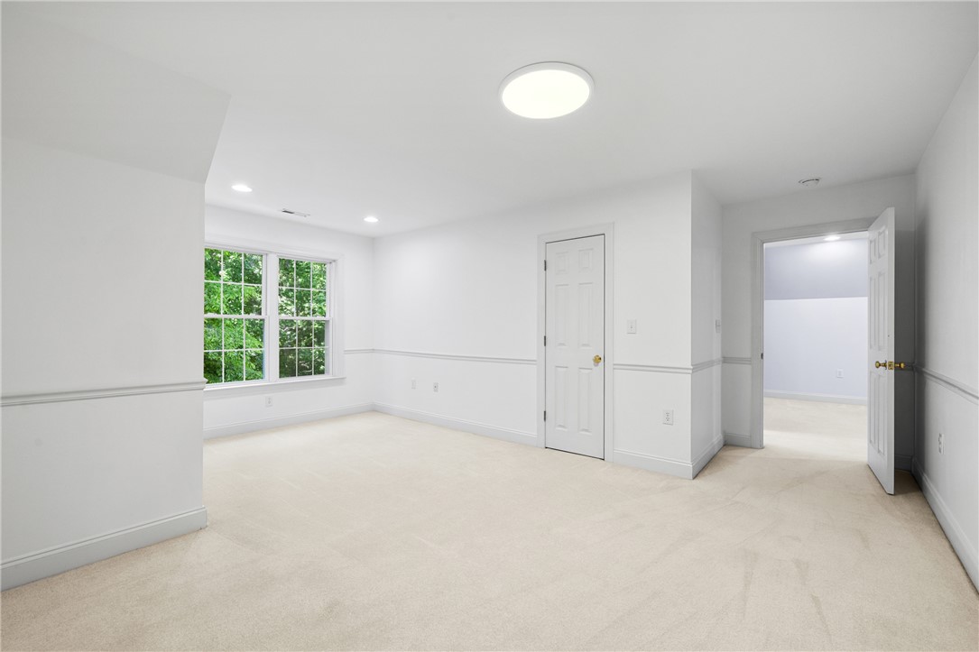 110 Brookstone Way Central, SC 29630 - Photo 33 of 46 This bright room features pristine white walls, carpet flooring, and ample natural light.