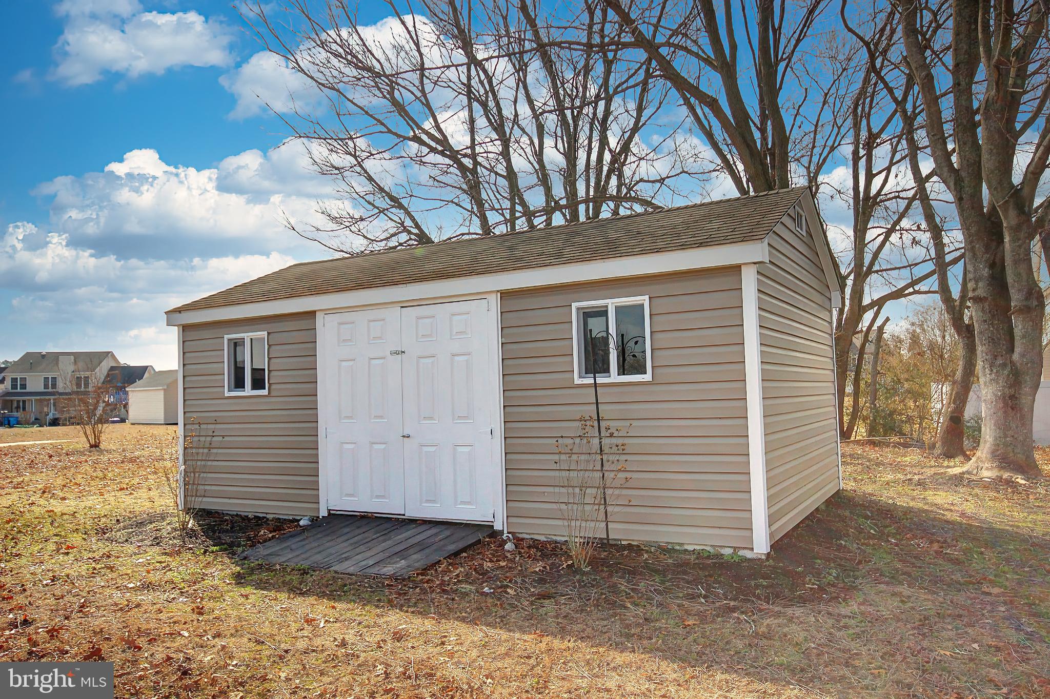 26177 Rewastico Road Hebron, MD 21830 - Photo 6 of 20 a view of a house with a yard