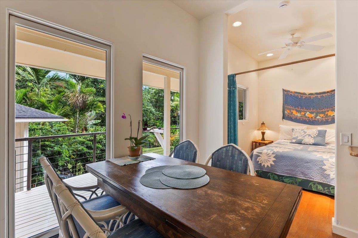 6900 Hana Highway Hana, HI 96713 - Photo 34 of 50 a view of a dining room with furniture a rug and wooden floor