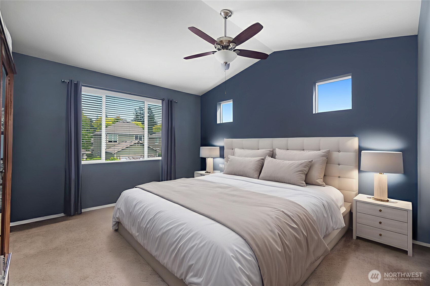 3526 Becket Street Northeast Lacey, WA 98516 - Photo 1 of 32 a bedroom with a large bed and a large window