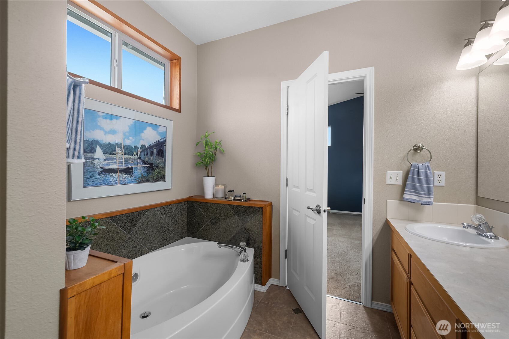 3526 Becket Street Northeast Lacey, WA 98516 - Photo 18 of 32 a bathroom with a tub and a sink