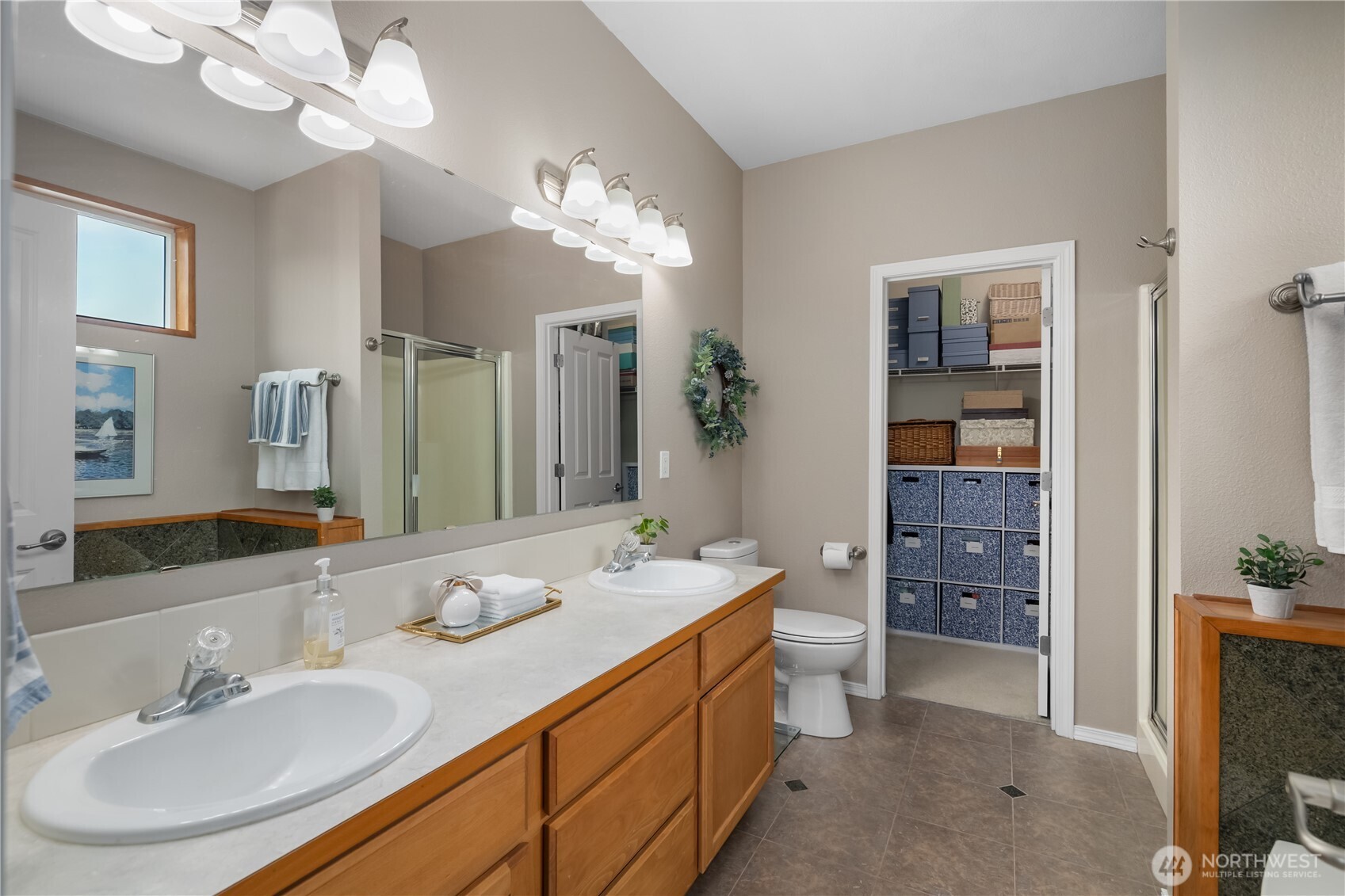 3526 Becket Street Northeast Lacey, WA 98516 - Photo 19 of 32 a bathroom with a sink a vanity and a mirror