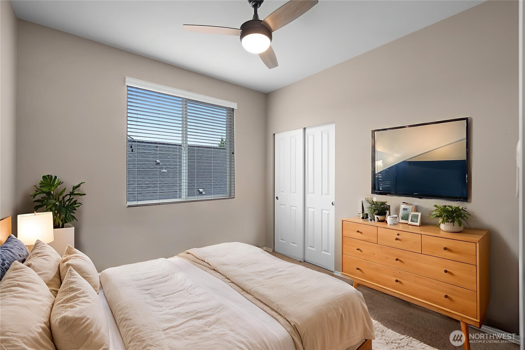 3526 Becket Street Northeast Lacey, WA 98516 - Photo 21 of 32 a bedroom with a bed and a flat screen tv