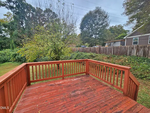 a view of deck with wooden floor and fence