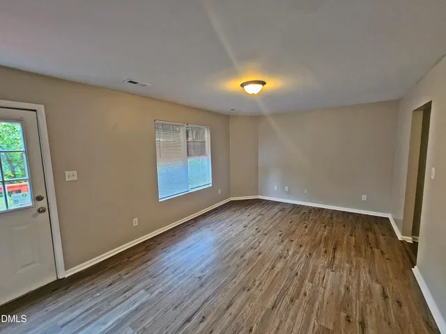 a kitchen with granite countertop sink stainless steel appliances and cabinets