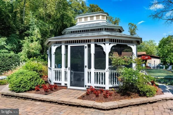 a view of a backyard with a table and chairs