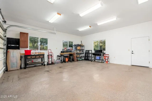a view of backyard with seating space and trees