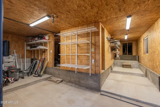 an aerial view of house with yard and mountain view in back