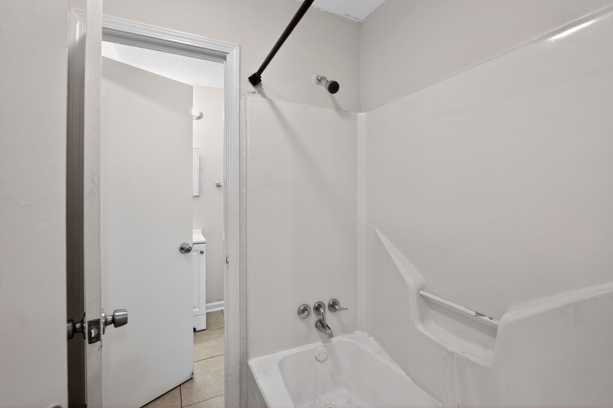 4725 Lofts Road Memphis, TN 38118 - Photo 23 of 32 Bathroom featuring bathing tub / shower combination and light tile patterned flooring