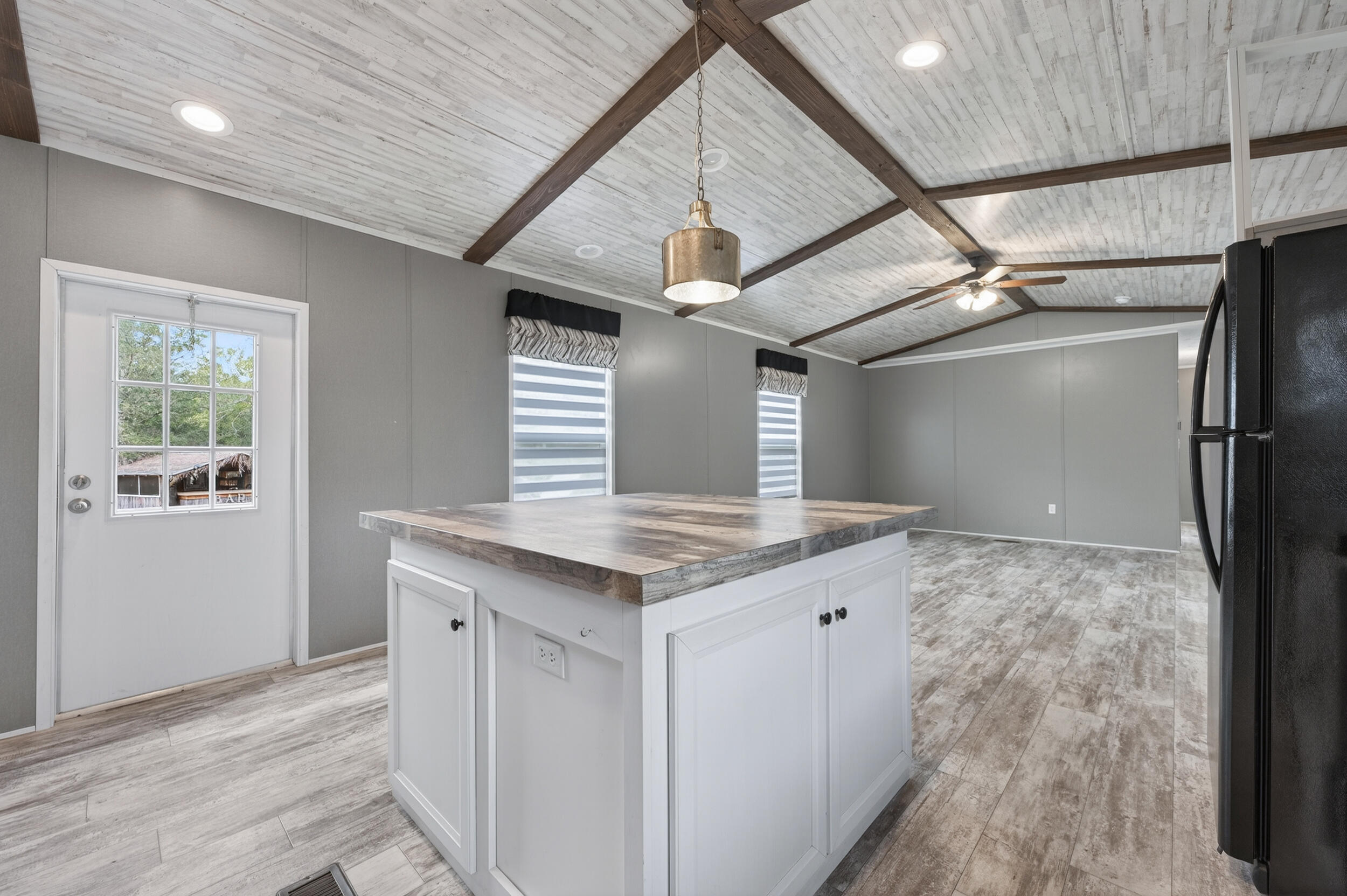 4528 Bryant Bridge Cutoff Road Holt, FL 32564 - Photo 12 of 63 a kitchen with a stove and a refrigerator
