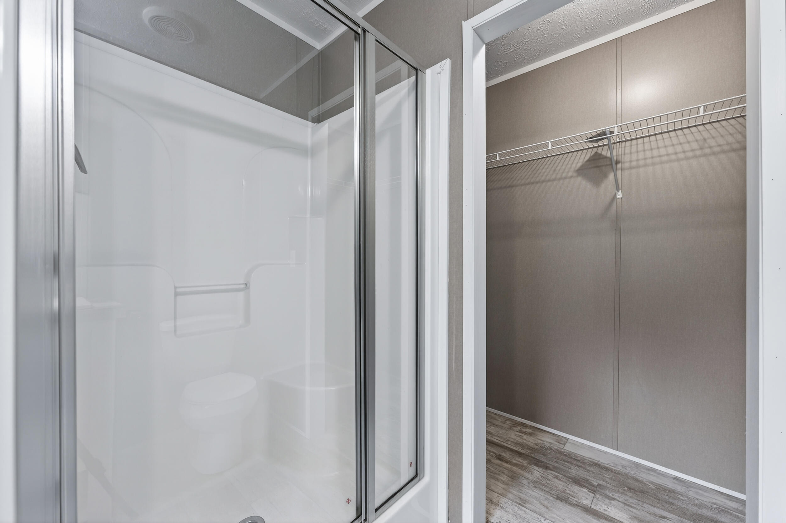4528 Bryant Bridge Cutoff Road Holt, FL 32564 - Photo 23 of 63 a bathroom with a glass shower door
