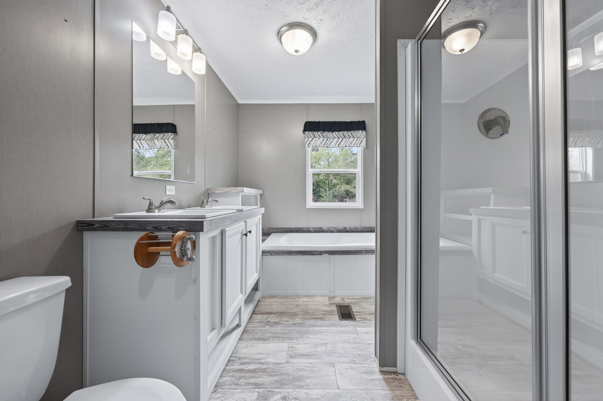 4528 Bryant Bridge Cutoff Road Holt, FL 32564 - Photo 25 of 63 a bathroom with a sink a toilet and shower