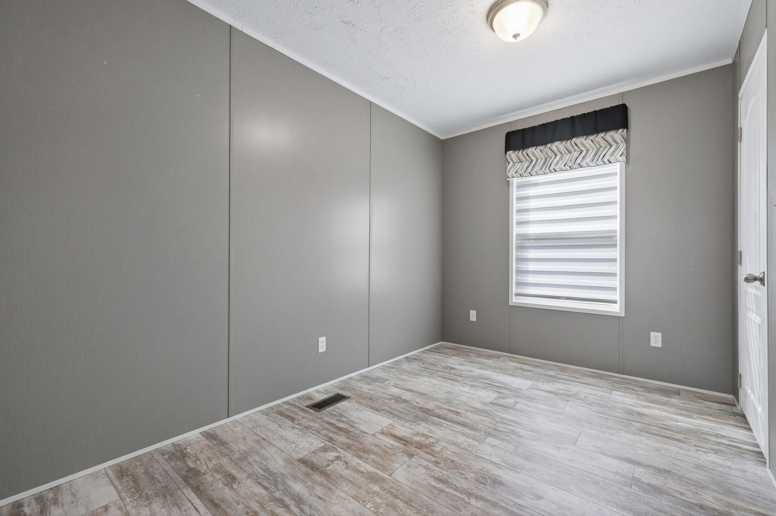 4528 Bryant Bridge Cutoff Road Holt, FL 32564 - Photo 34 of 63 a view of empty room with wooden floor