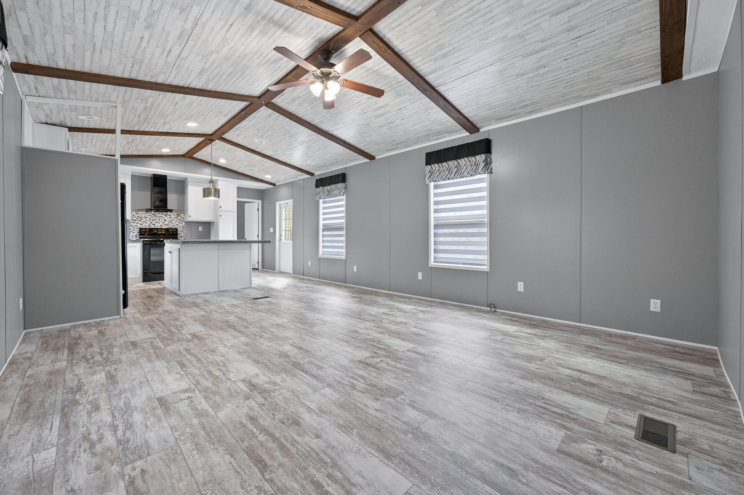 4528 Bryant Bridge Cutoff Road Holt, FL 32564 - Photo 4 of 63 a view of a livingroom with a dishwasher and furniture wooden floor