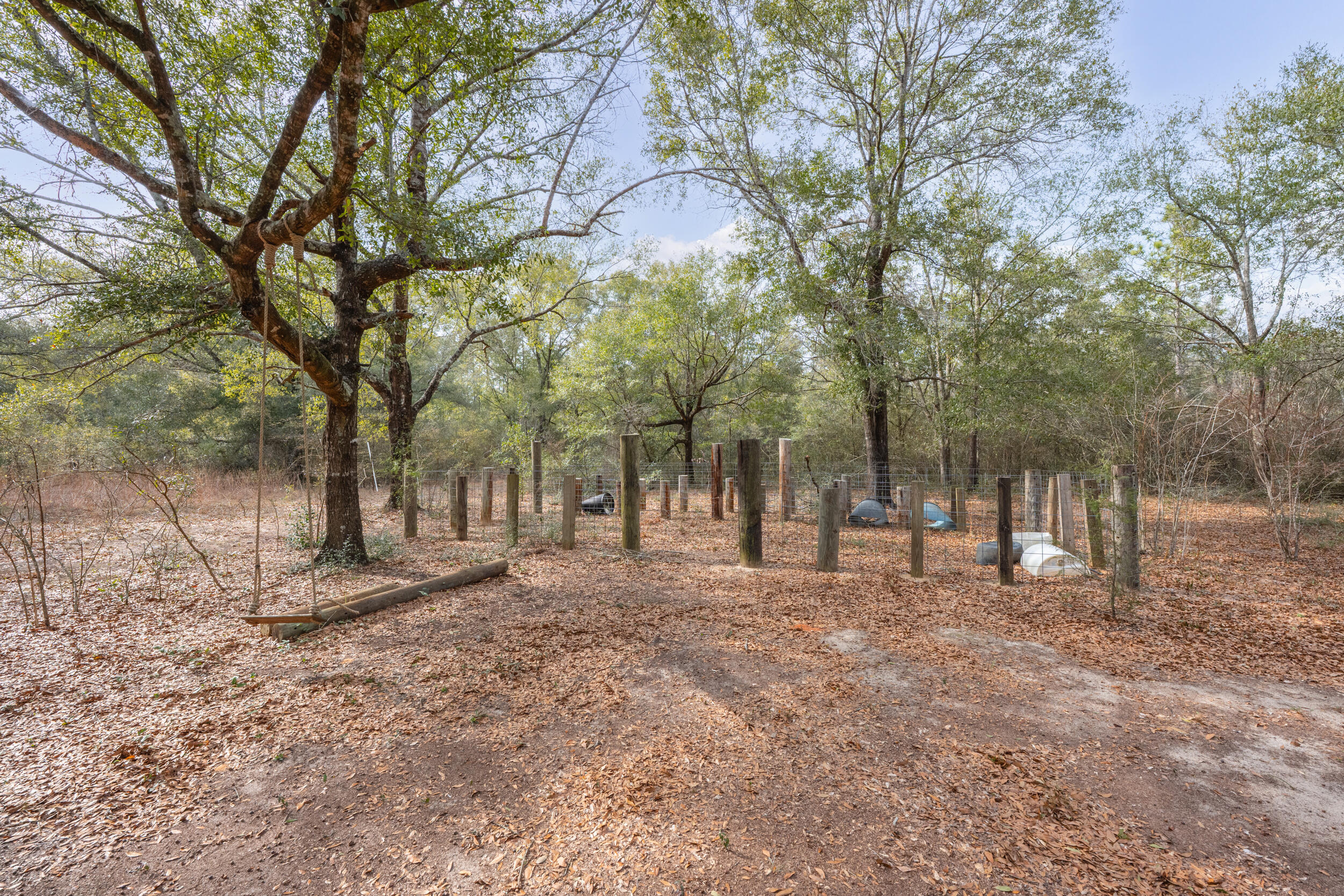 4528 Bryant Bridge Cutoff Road Holt, FL 32564 - Photo 63 of 63 a backyard of a house with lots of green space