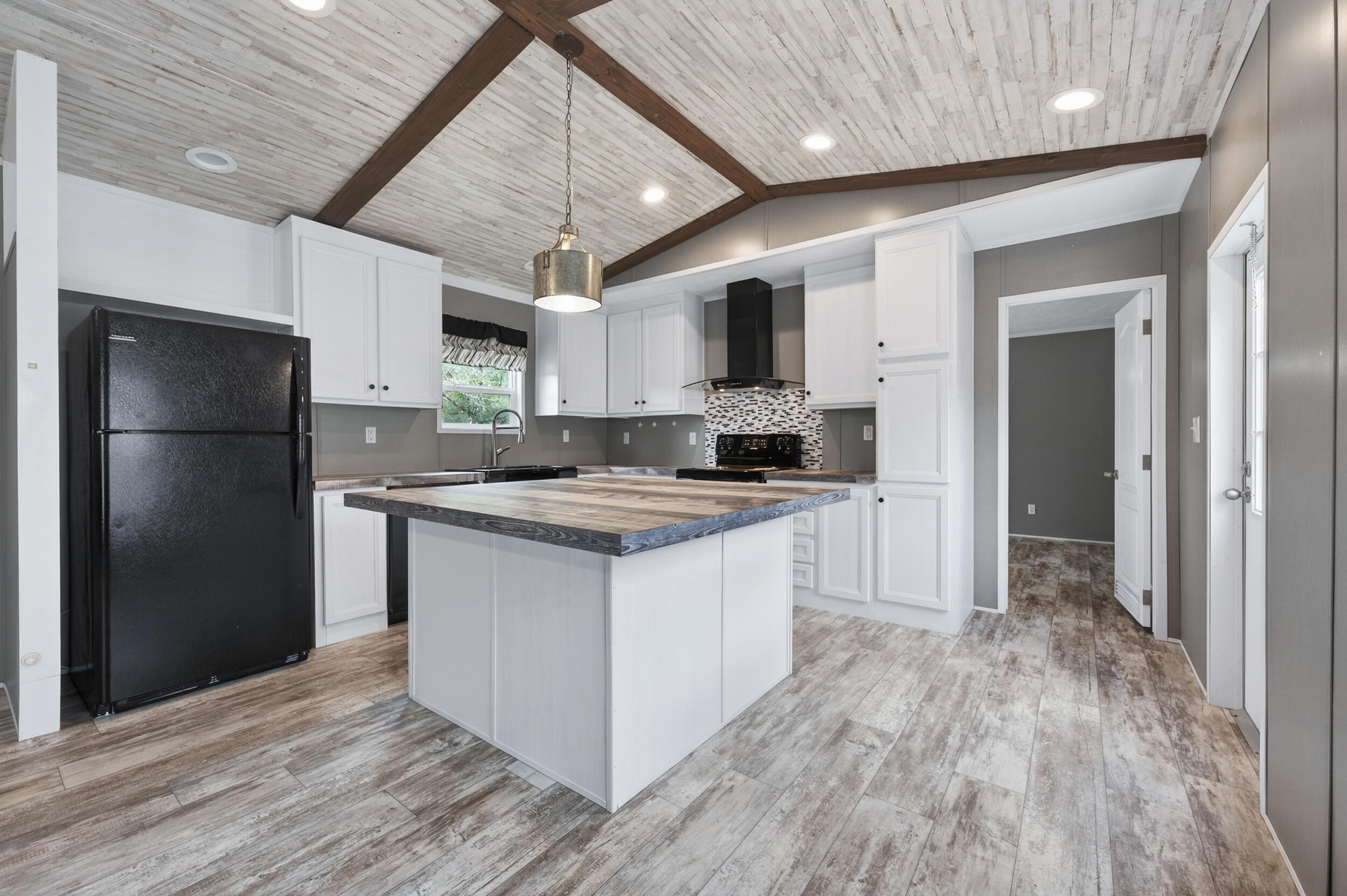 4528 Bryant Bridge Cutoff Road Holt, FL 32564 - Photo 8 of 63 a kitchen with stainless steel appliances granite countertop a refrigerator a sink and a stove