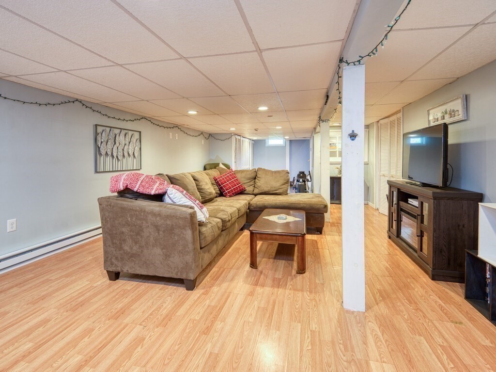 81 Webber Road Brookfield, MA 01506 - Photo 27 of 34 a living room with furniture and a wooden floor