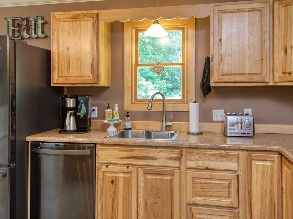 81 Webber Road Brookfield, MA 01506 - Photo 6 of 34 a kitchen with granite countertop cabinets stainless steel appliances a sink and a window