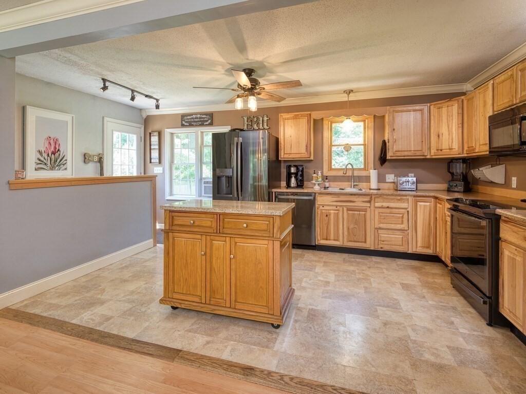 81 Webber Road Brookfield, MA 01506 - Photo 10 of 34 a kitchen with granite countertop cabinets stainless steel appliances and a window