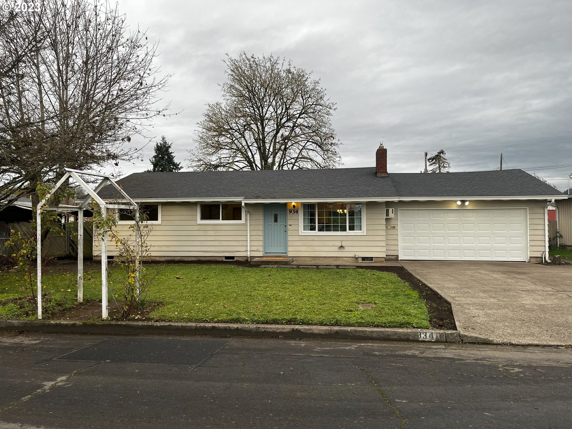 a front view of a house with a garden
