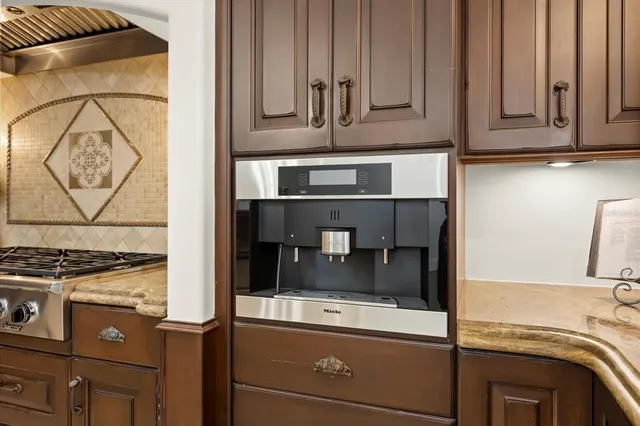 a front view of a house with yard and balcony