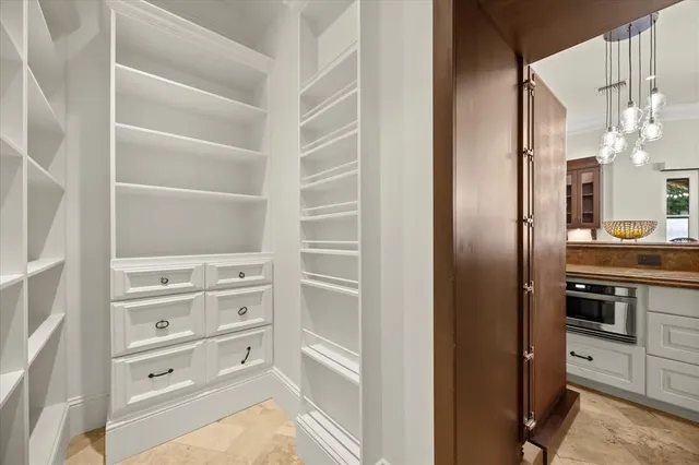 a view of a house with swimming pool and sitting area