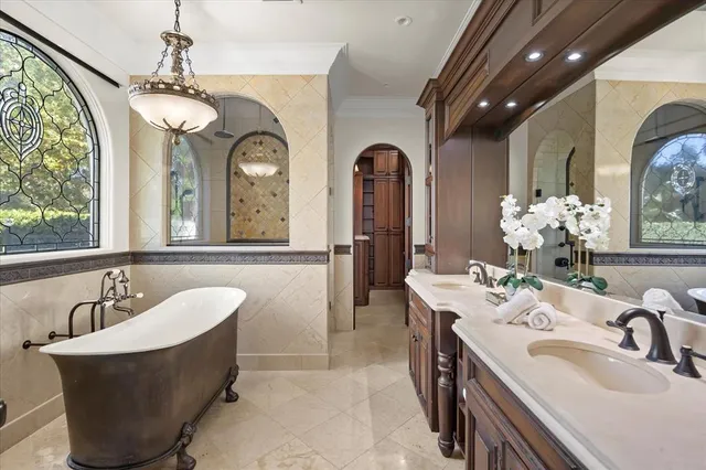 a room with a table and a chandelier