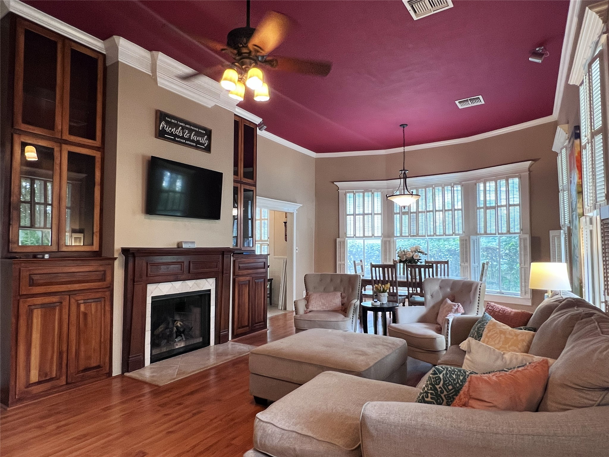 606 Sycamore Street Brenham, TX 77833 - Photo 7 of 27 a living room with furniture a fireplace and a flat screen tv