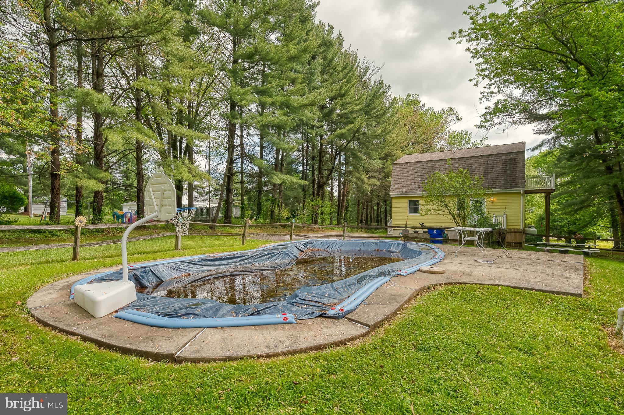 710 Magnolia Road Joppa, MD 21085 - Photo 55 of 58 a swimming pool with outdoor seating and yard