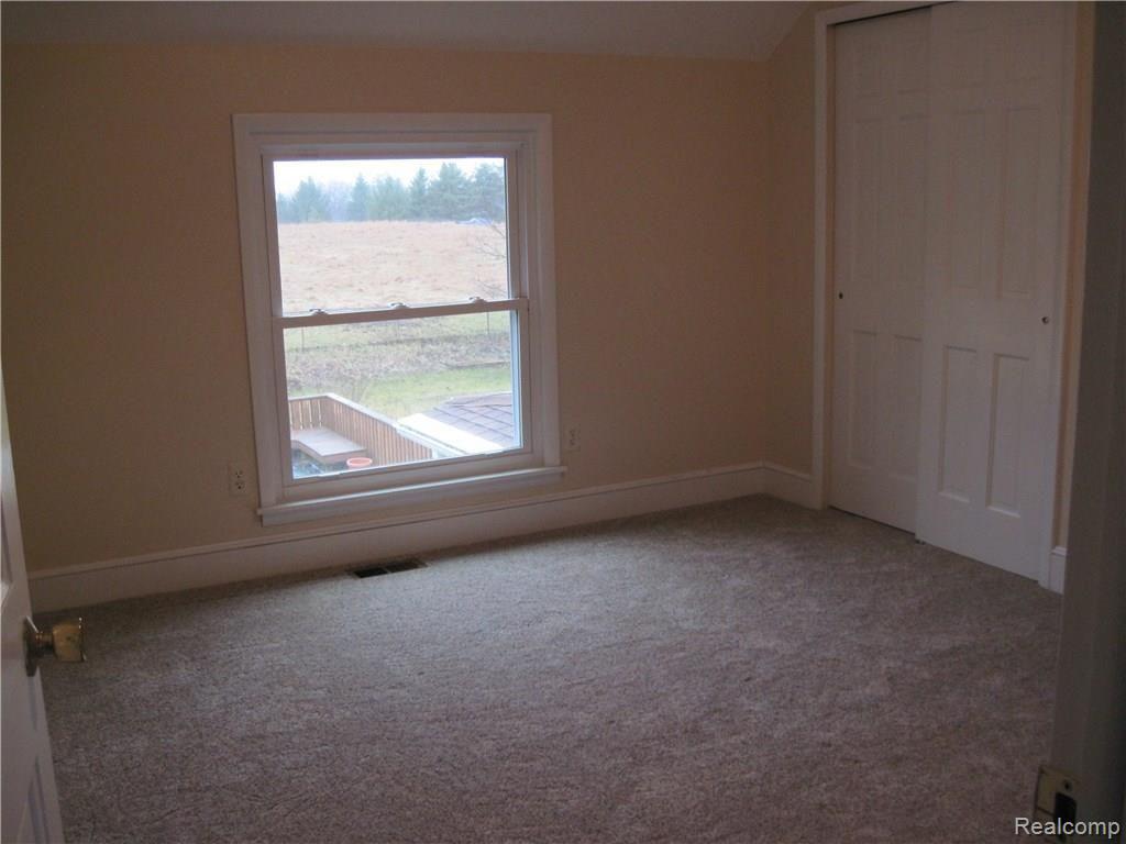 60 West Sutton Road Metamora, MI 48455 - Photo 32 of 39 Upstairs Apartment Bedroom