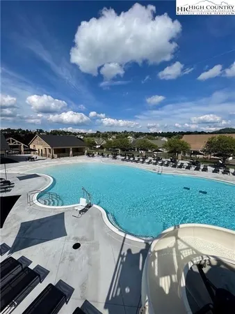 an outdoor space with furniture and city view