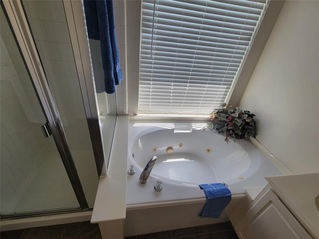 2913 Rush Creek Road McKinney, TX 75072 - Photo 9 of 32 Bathroom featuring tile patterned flooring, separate shower and tub, and double vanity