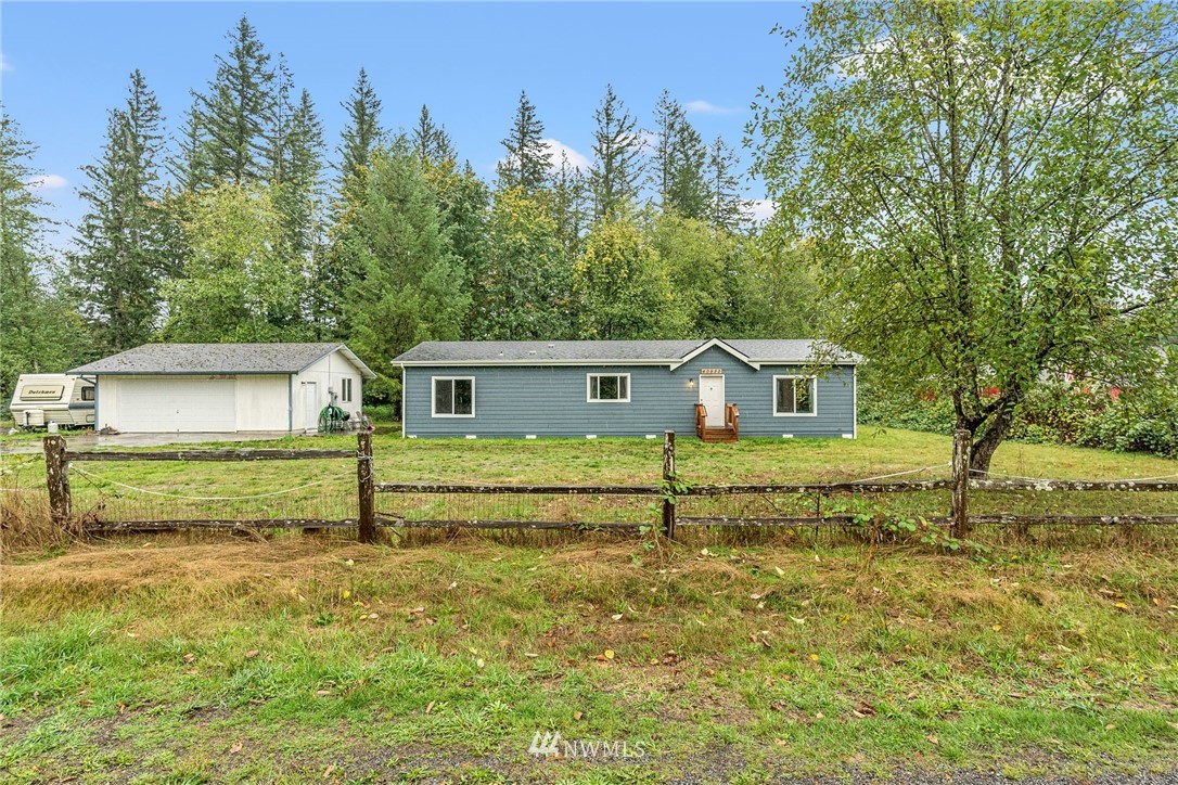 40822 Dorman Road Gold Bar, WA 98251 - Photo 1 of 34 a front view of a house with a yard