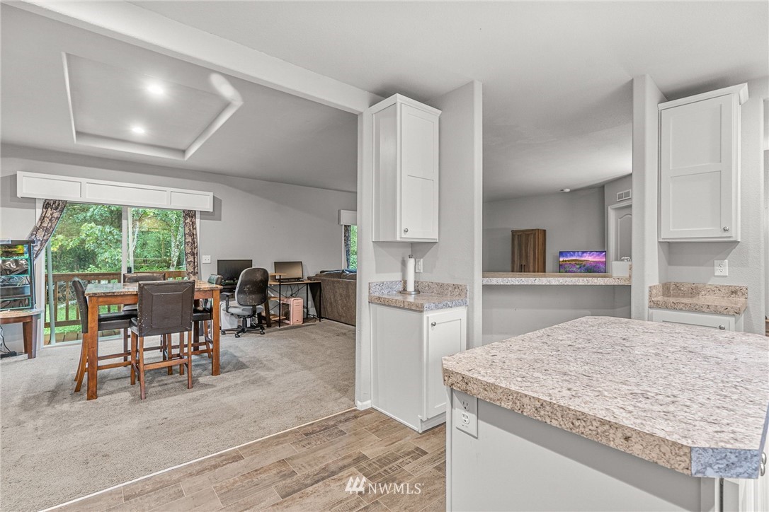 40822 Dorman Road Gold Bar, WA 98251 - Photo 14 of 34 a kitchen with stainless steel appliances granite countertop sink stove and white cabinets