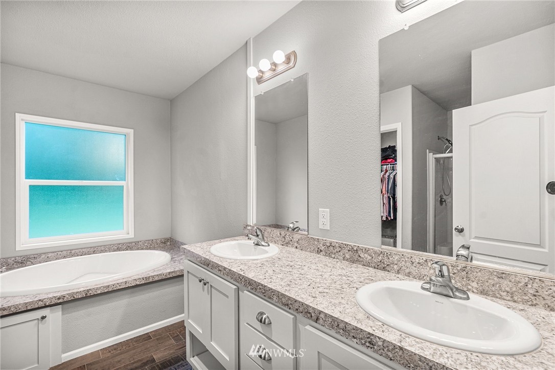 40822 Dorman Road Gold Bar, WA 98251 - Photo 23 of 34 a bathroom with a granite countertop sink and a mirror