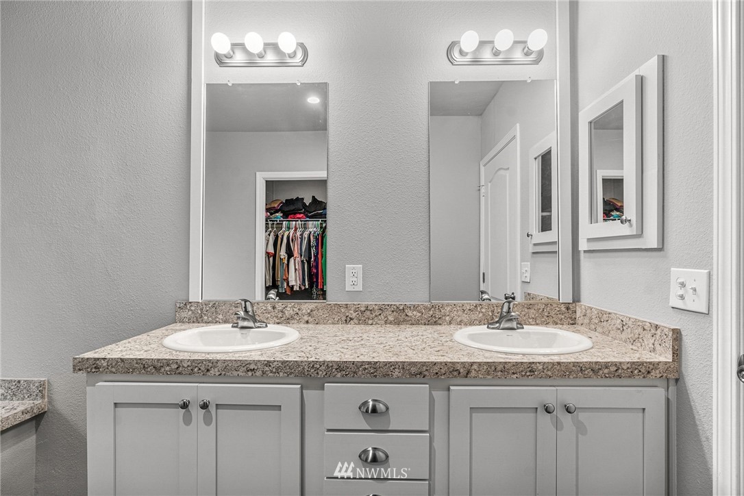 40822 Dorman Road Gold Bar, WA 98251 - Photo 24 of 34 a bathroom with a granite countertop sink a mirror and a